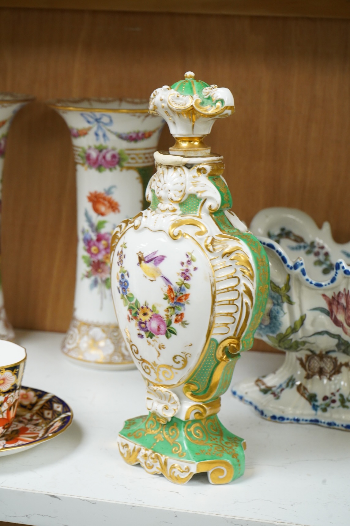 A pair of Dresden vases, a Paris porcelain bottle and stopper, a faience bowl and two Royal Crown Derby cups and saucers, tallest 26cm